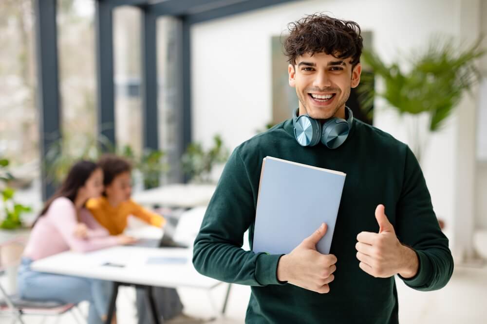 a student smiling about his success